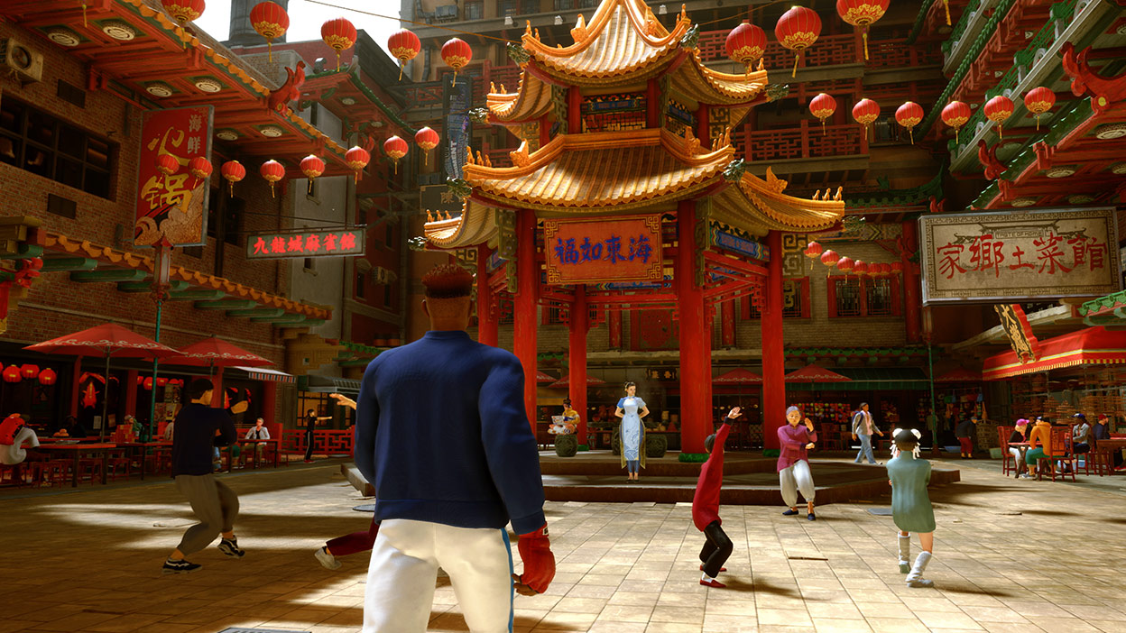 A fighter enters a Chinese plaza with other people practicing martial arts.