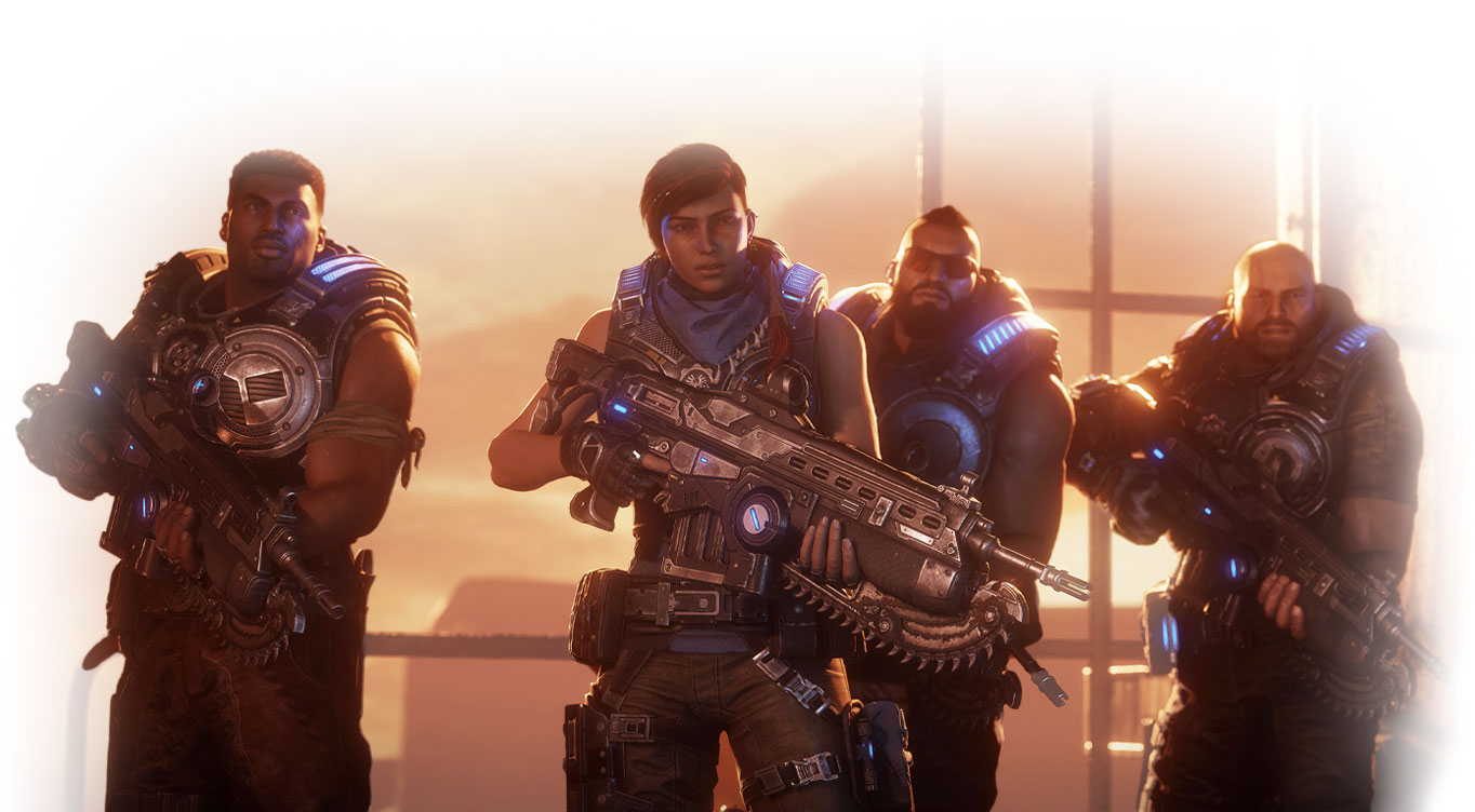 Gears 5. Kait Diaz und ihr Team stehen vor einem großen Industriefenster, das auf eine Wüste hinausgeht.