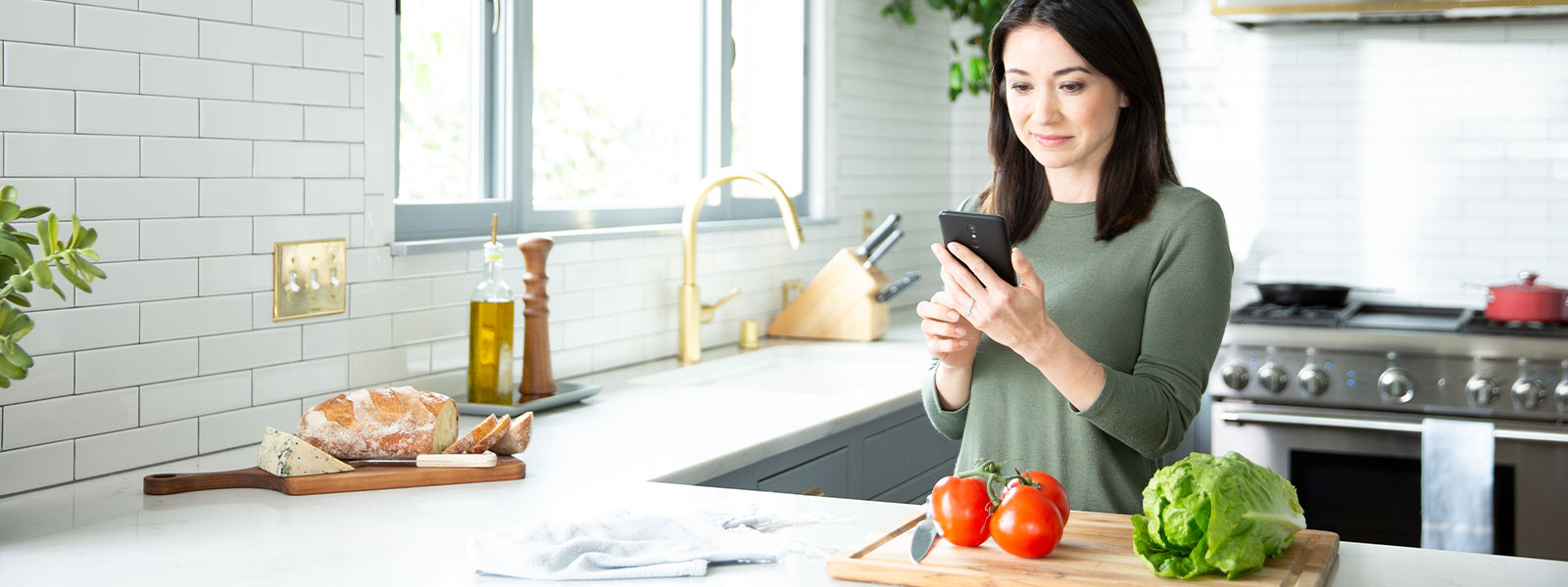 A woman checks safety settings on her mobile phone