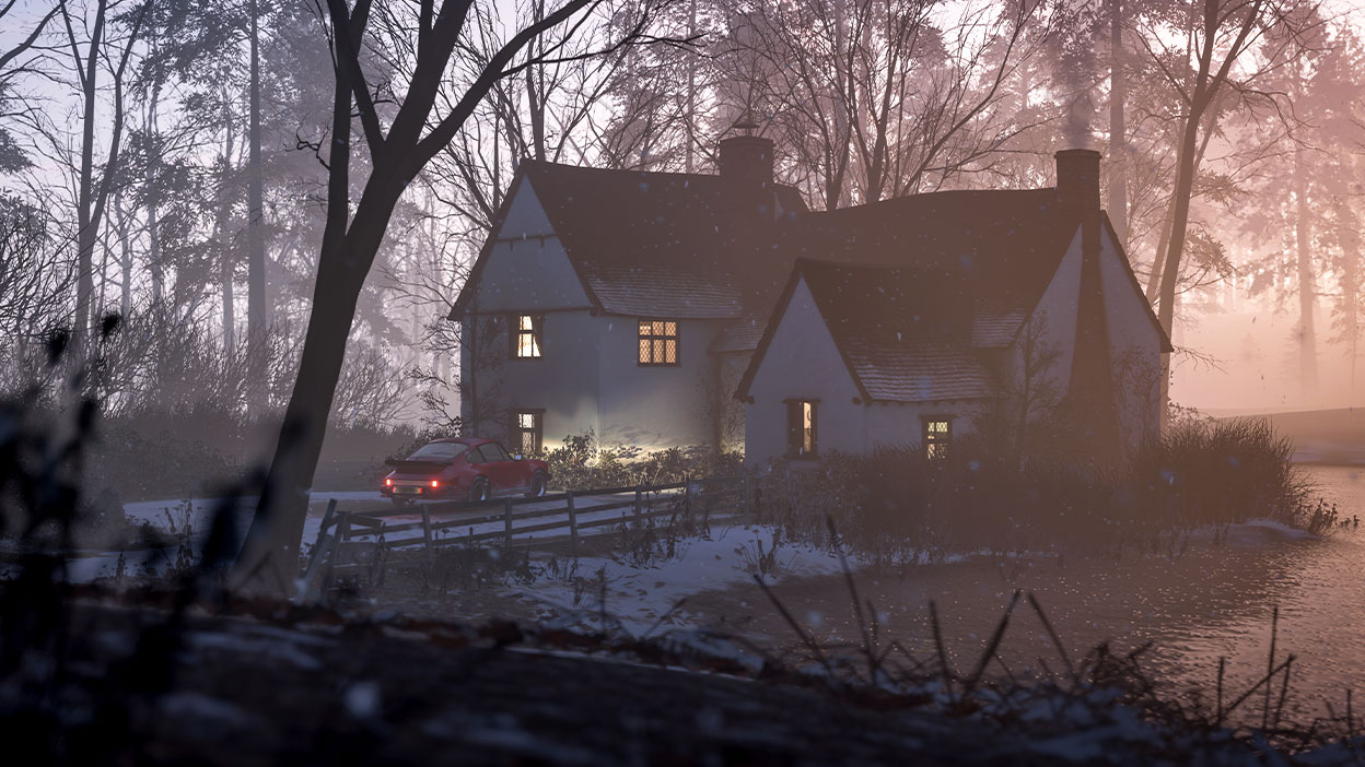 A peaceful lakeside cottage at dusk in the snowfall, lights glowing through the window